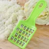 Close-up shot of a multifunction cabbage filling cutter with shredded cabbage in the container