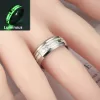 Close-up of two stainless steel rings with glowing hearts