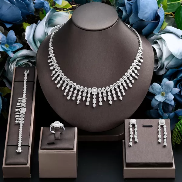 A photo showcasing all four pieces of the Cubic Zirconia jewelry set laid out together on a white background. Each piece should be clearly visible, highlighting the sparkle of the cubic zirconia gemstones.
