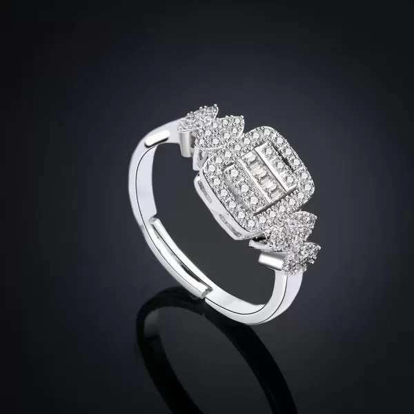 Close-up photo of a sparkling diamond engagement ring on black velvet.