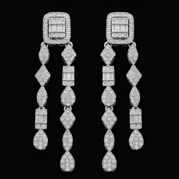 Close-up of elegant white gold diamond stud earrings.