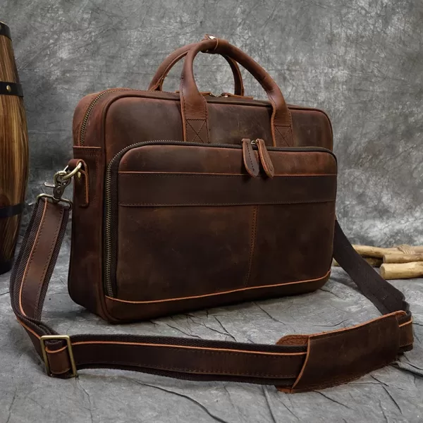 A brown leather briefcase with a classic design, ideal for business professionals and travelers.