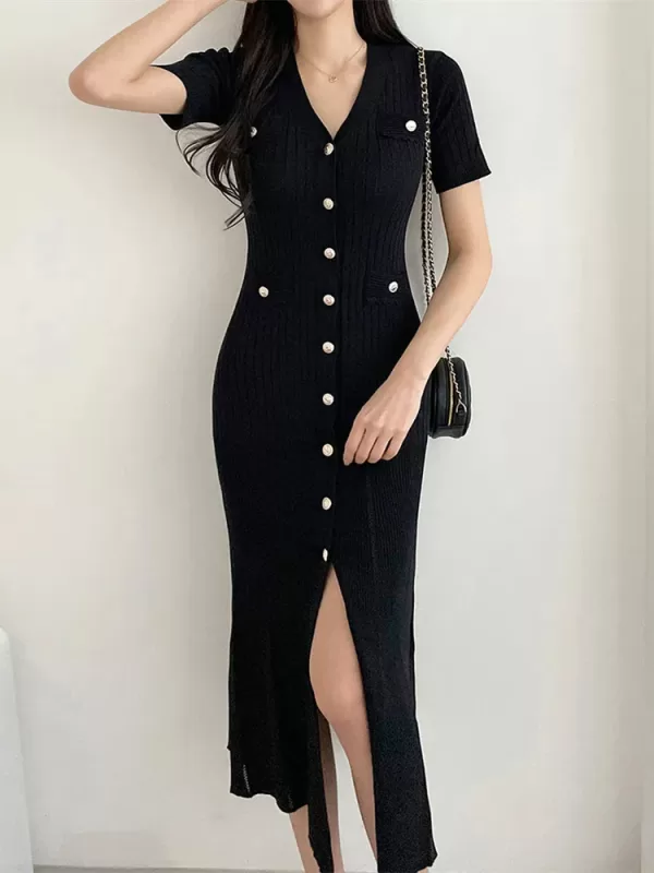 Back view of the black knitted midi dress, highlighting its elegant design.