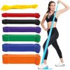 Set of colorful resistance bands with woman demonstrating exercise.
