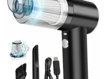 Close-up view of a handheld vacuum showing the built-in LED light illuminating the floor