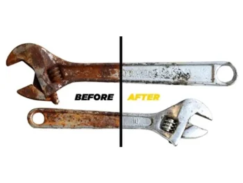 Person using Zang remover spray on a rusty bike chain to restore metal