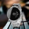 Black and white men's watch styled casually on a wooden surface