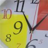 Close-up view of the colorful face of a modern digital wall clock.
