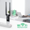 USB WiFi repeater being plugged into a laptop's USB port
