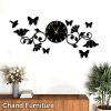A stylish wooden wall clock featuring 3D butterflies, flowers, and birds, perfect for home or office decor in Pakistan.
