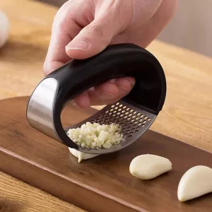Stainless steel garlic press with comfortable handles for easy crushing and mincing garlic cloves.