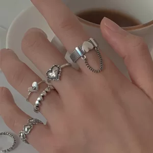 A photo showcasing a variety of Women's Fashion Rings in different styles and colors, arranged on a festive background.