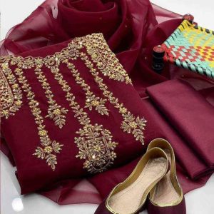 A luxurious 4-piece outfit featuring organza fabric adorned with intricate zari beadwork. Includes a qattan silk trouser and khussa shoes. Perfect for festive occasions.