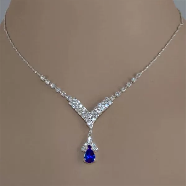 Confident woman wearing a blue gemstone necklace, perfect for a night out