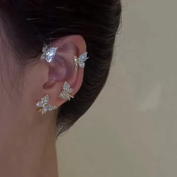 Model wearing silver plated butterfly clip earrings, highlighting their flattering look on the ears.