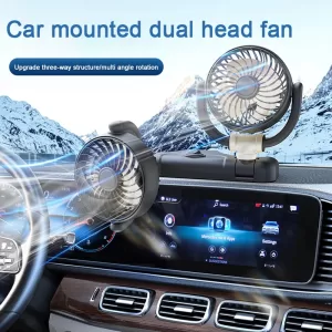 A black Breeze Buddy with two adjustable fan heads securely mounts onto the air vent of a car dashboard. The car interior appears cool and comfortable.