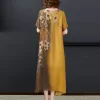 A summer outfit featuring a cotton linen midi dress paired with sandals and a straw hat.