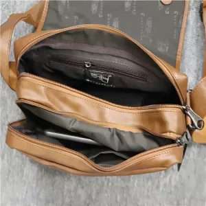 Close-up photo of a brown leather messenger bag