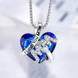 Silver necklace with a heart-shaped pendant that reads "I love you mom" in cursive writing.