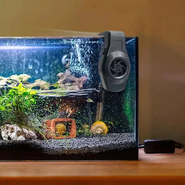 A hand easily plugs the USB Aquarium Fan into a power bank.