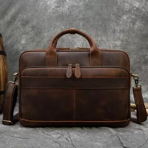 A professional brown leather briefcase with ample space for laptops, documents, and other essentials.