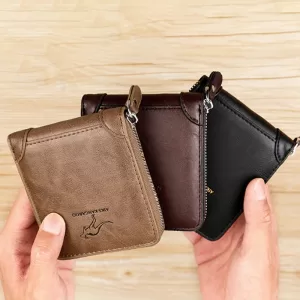 A person holding three trifold leather wallets in different colors: black, brown, and tan.