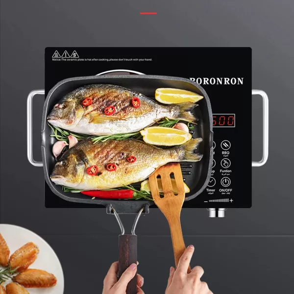 A sizzling pan on the induction cooktop, showcasing the rapid and even heat distribution ideal for searing, stir-frying, and boiling.