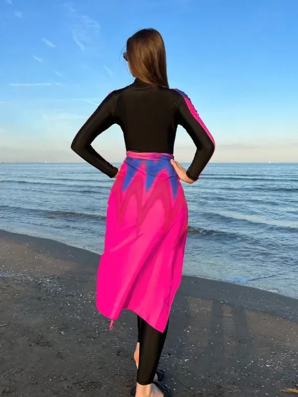 Model wearing a Burkini swimsuit with multiple pieces