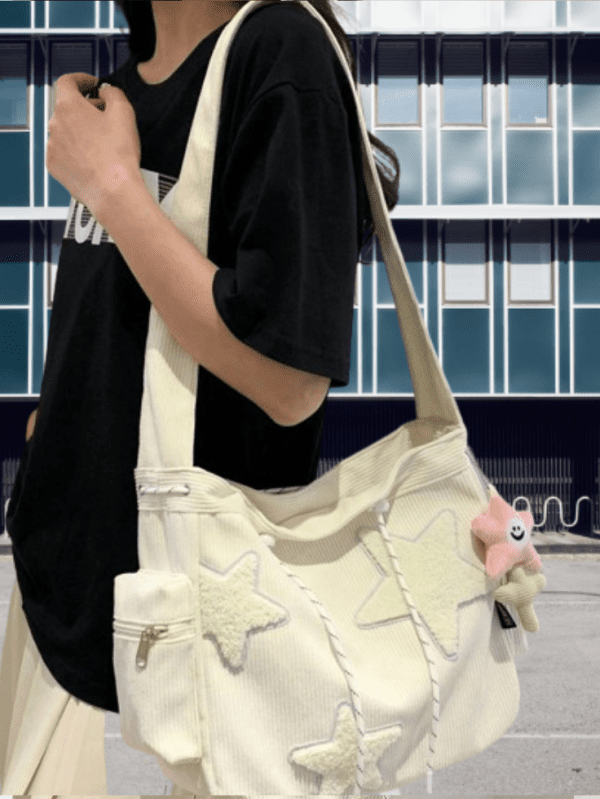 Close-up photo of a corduroy shoulder bag with contrasting colors and star decorations.