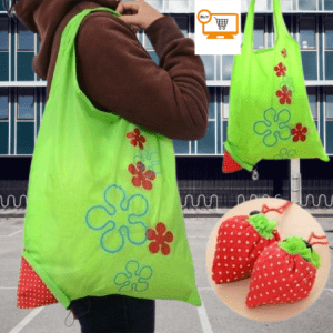 Person carrying a reusable canvas tote bag filled with groceries exiting a grocery store.