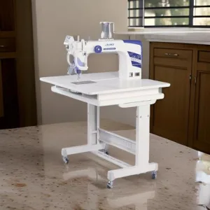 Portable sewing machine with stand on table.