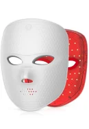 White textured facial LED light therapy mask shown from the front with eye and nose openings, power button symbol on the forehead, and ventilation holes on the chin alongside an inner red shell lined with LED light nodes.