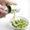 Making zucchini noodles with spiral slicer Using a spiralizer for vegetable prep Spiralizing vegetables in the kitchen
