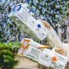 Child using a 60-hole LED bubble gun outdoors creating hundreds of bubbles (1).