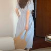 Flat lay of striped lapel dress showing pattern and cut