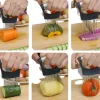Hands using a food slicer with stainless steel prongs to hold and guide a knife cutting various vegetables: carrot, squash, purple yam, cucumber, potato, and tomato.