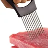 Onion holder for easy and uniform slicing. Stainless steel onion slicer tool. Hand holding an onion cutting aid. Kitchen gadget for slicing onions. Onion holder with prongs for stable cutting.