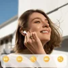 A smiling woman with short brown hair wearing a white wireless earbud in her right ear, touching her ear with her right hand. Touch-sensitive controls for play/pause, Siri, call answer/end, skip forward, and volume up/down are overlaid at the bottom.