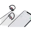 Boean Bluetooth wireless headphones on a gym towel next to a water bottle (3).