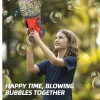 Child playing outside with 2025 electric bubble gun shooting bubbles (2).