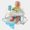 Smiling baby sitting in a Fisher-Price Sit-Me-Up Chair with snack tray on a colorful floor (3).