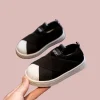 White, black, and gray slip-on canvas shoes sneakers for toddlers and kids (2).