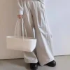 Woman wearing Korean-style wide-leg drape trousers outdoors (3).