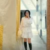 Woman wearing a Korean lace puff sleeve shirt and matching skirt, styled for a casual chic look (2).