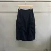 Woman wearing a Korean pleated workwear skirt with drawstring waist and side pockets (2).