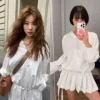 Model wearing Korean-style pleated skirt pants, perfect for spring fashion and casual office wear (2).