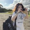 Woman wearing a cute Korean-style spotted dog short-sleeved T-shirt (1).