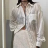 Women wearing a thin Korean-style vertical striped long-sleeved shirt in a casual indoor setting (1).