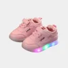 Toddler wearing 2025 LED light-up sneakers shoes glowing lights in motion on both (1).