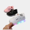 Toddler wearing 2025 LED light-up sneakers shoes glowing lights in motion on both (3).